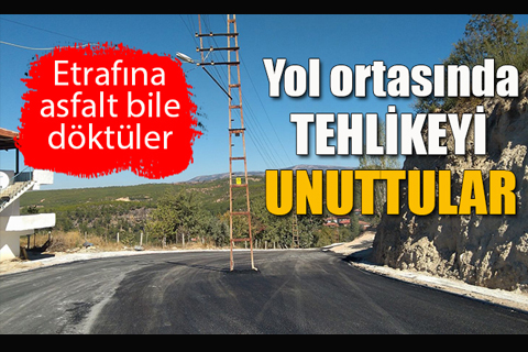 Yolu asfaltladılar ama direk yerinde kaldı