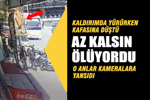 Başına düşen inşaat parçaları ile yaralandı
