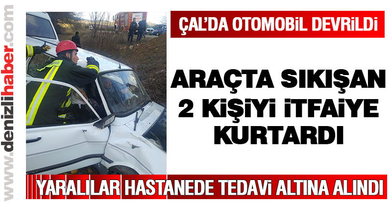 Refüje çarpıp devrilen otomobilde 2 kişi sıkıştı