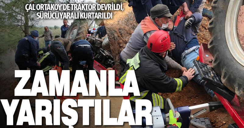 Devrilen traktörün sürücü zamana karşı yarışla kurtarıldı