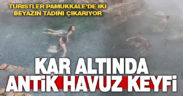 Pamukkale’de turistler kar altında termal havuza girdi