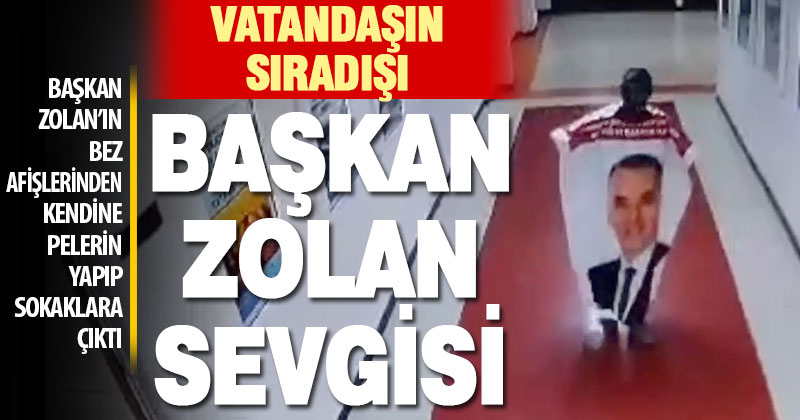 Bir vatandaş, Başkan Zolan’ın bez afişlerinden yaptığı pelerinle sokaklara çıktı