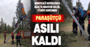 Ağaçta asılı kalan yamaç paraşütçüyü itfaiye kurtardı
