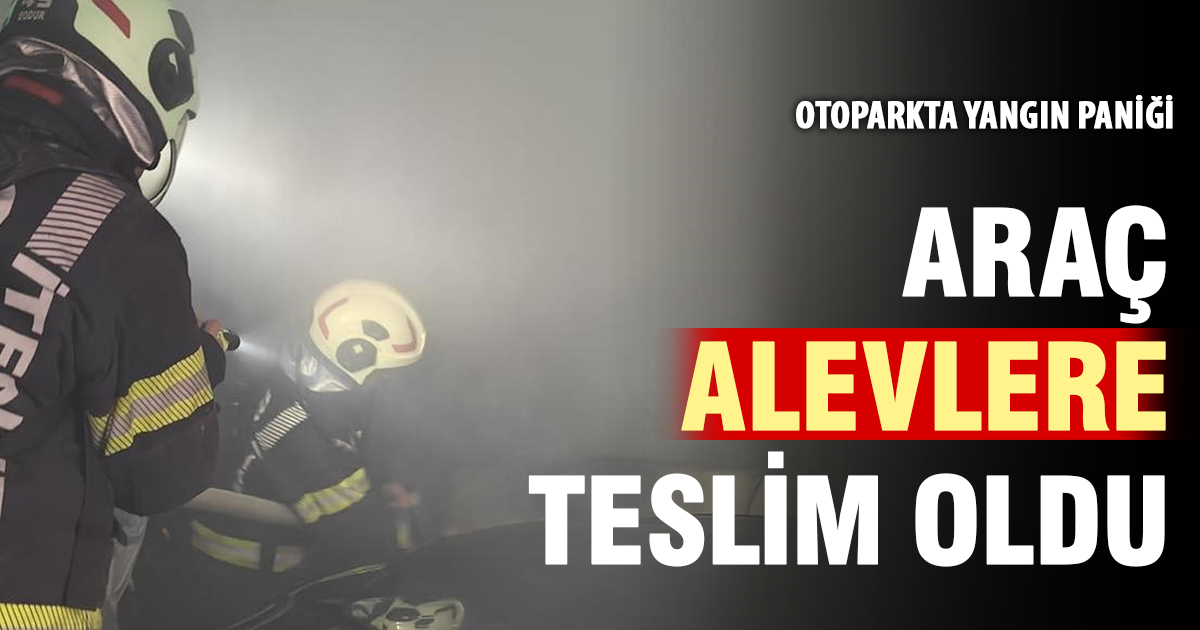 Kapalı otoparkta duran otomobile alevler sarsı 